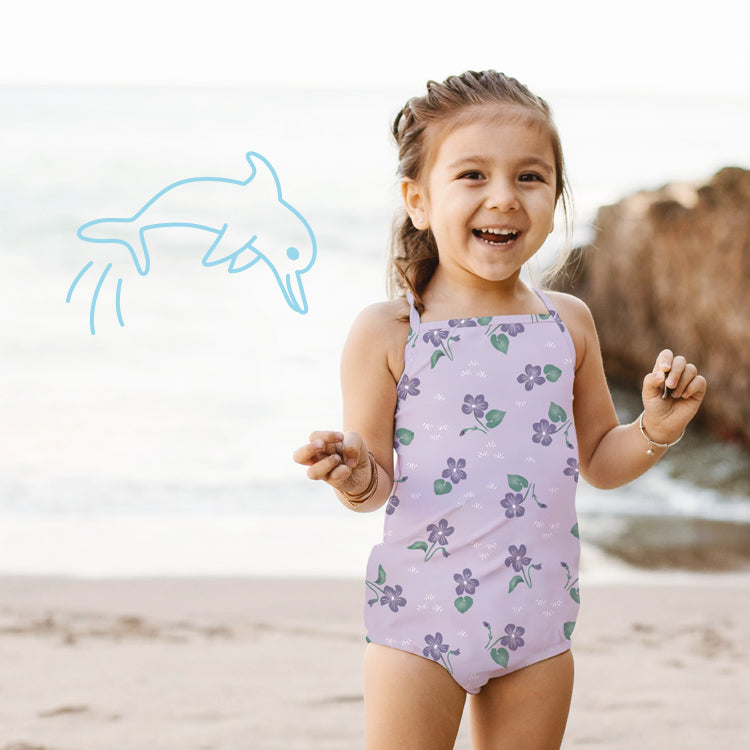 toddler girl wearing diaper under swimsuit