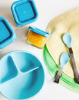 The Aqua Learning Bowl made from Silicone next to aqua learning spoons and aqua storage cubes